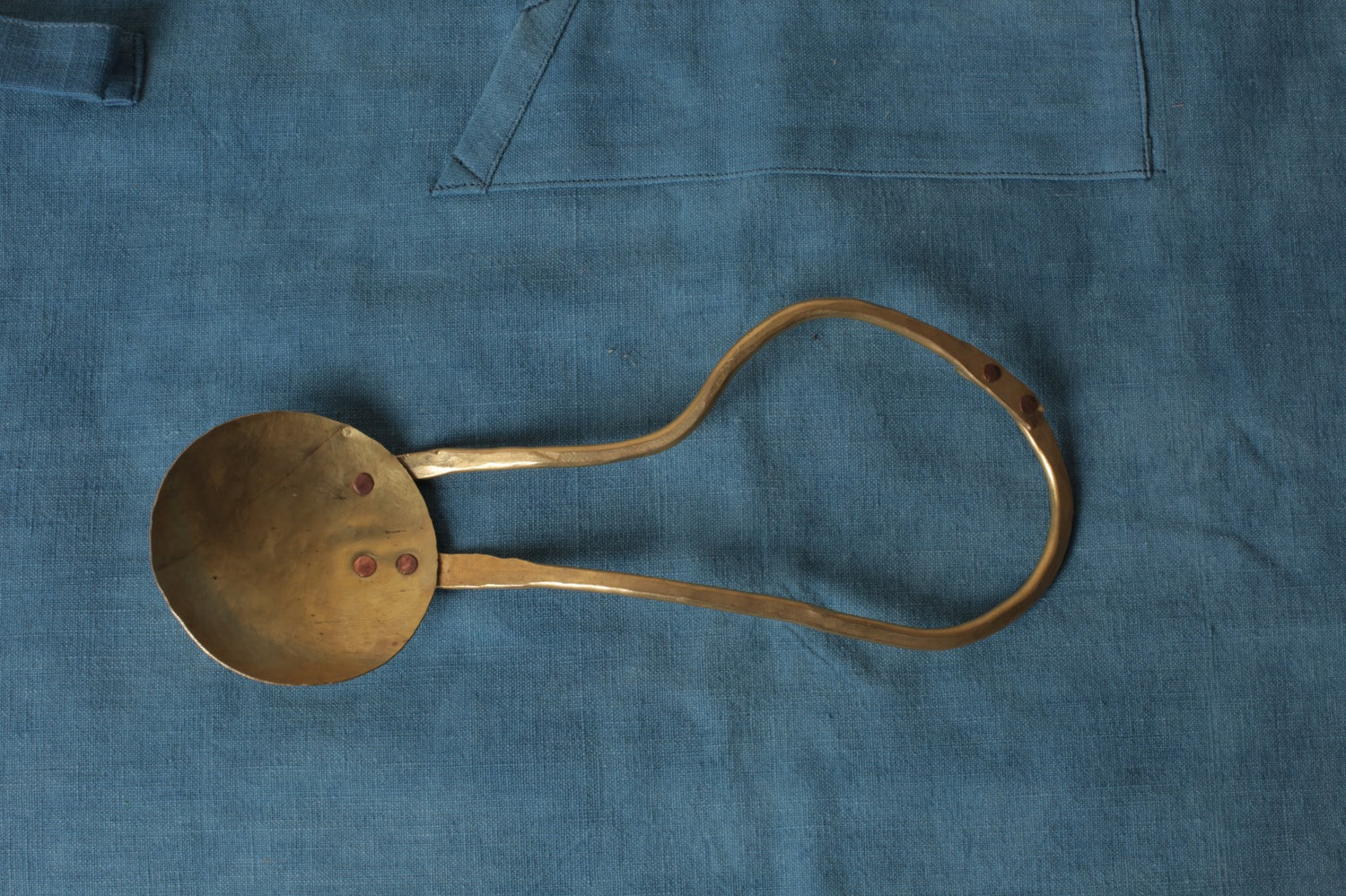 Brass serving spoon by Sebastião Lobo