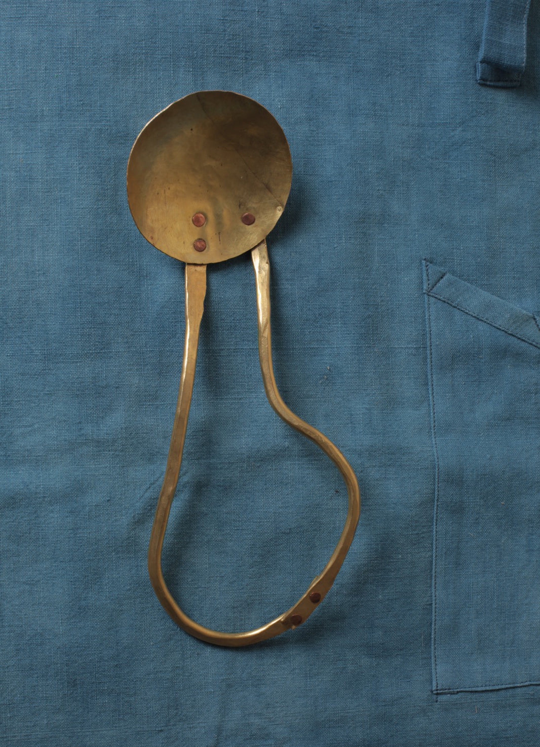 Brass serving spoon by Sebastião Lobo