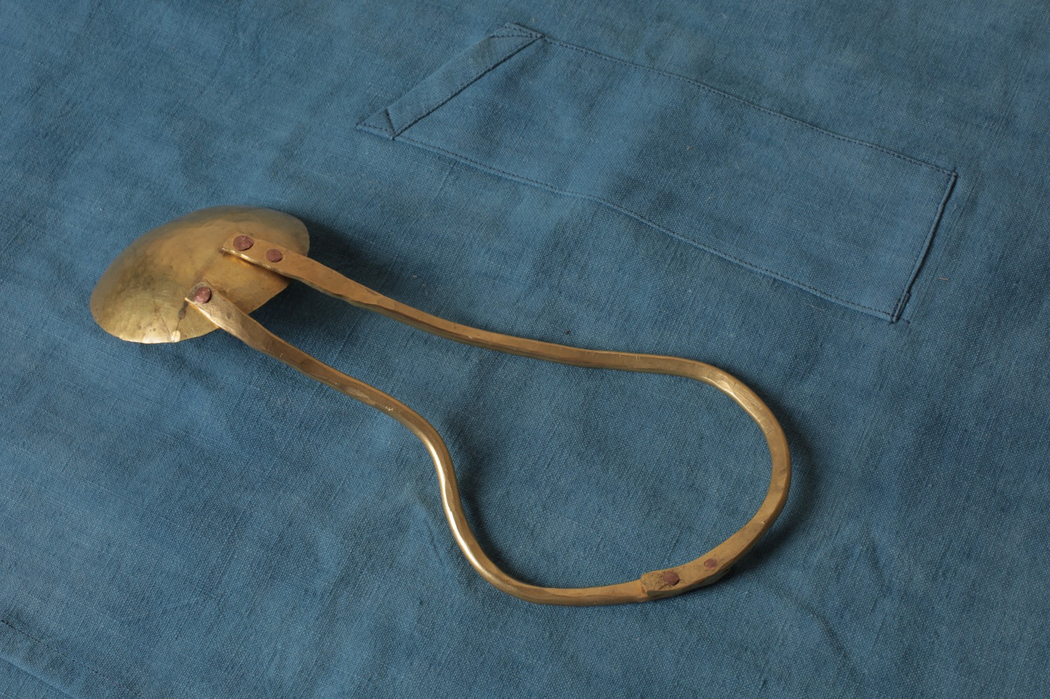 Brass serving spoon by Sebastião Lobo