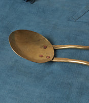 Brass serving spoon by Sebastião Lobo