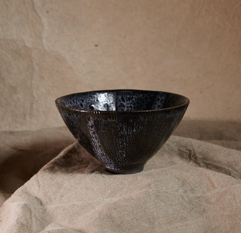 Black stoneware bowl by Sara Mauvilly