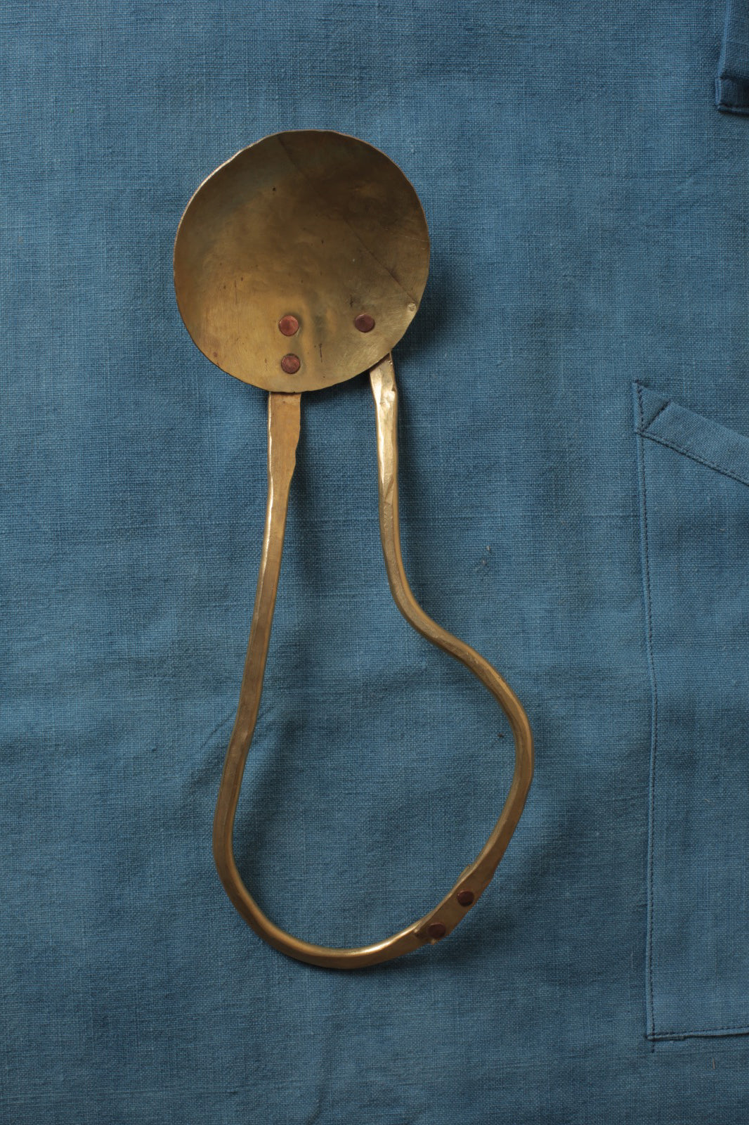 Brass serving spoon by Sebastião Lobo