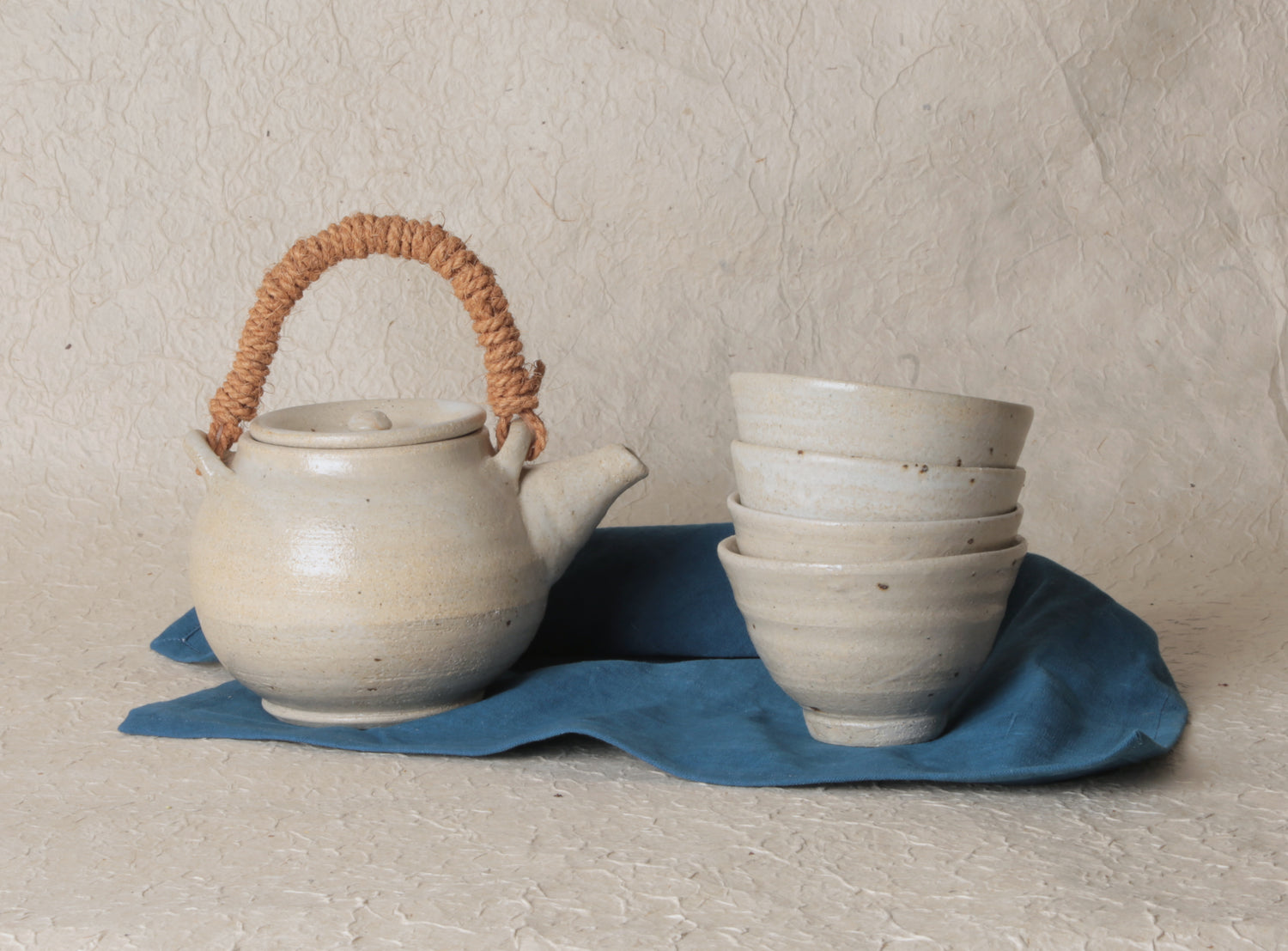Stoneware teapot and cup by Marie Lautrou