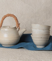 Stoneware teapot and cup by Marie Lautrou