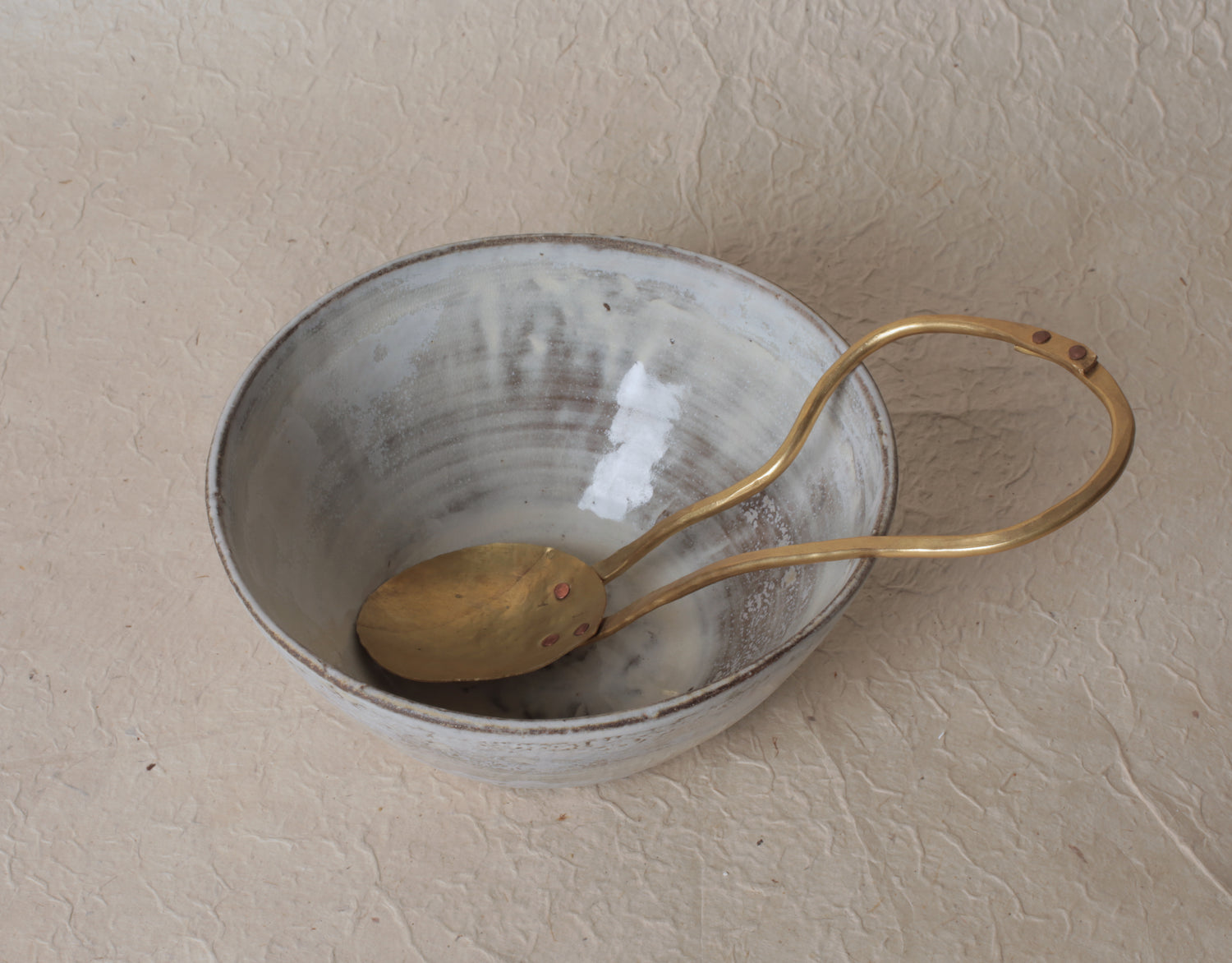 Brass serving spoon by Sebastião Lobo