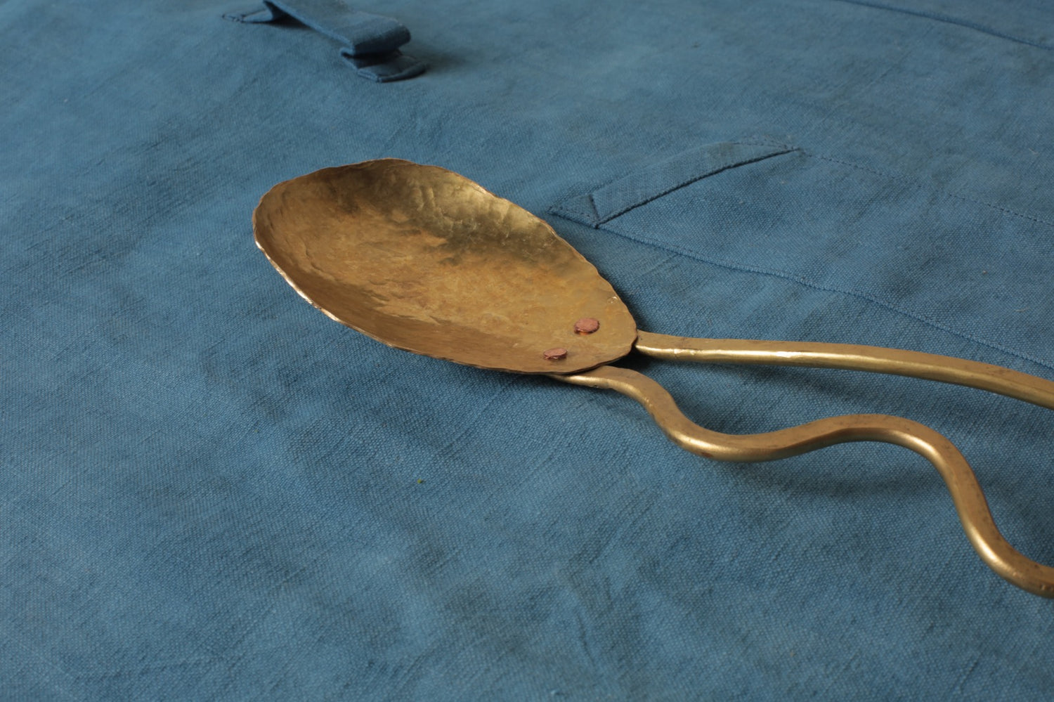 Brass serving spoon by Sebastião Lobo